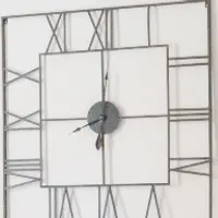 Large open-frame wall clock with Roman numerals