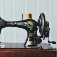 Hand-crank sewing machine with gilt decal work